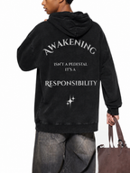 Awakening Isn't a Pedestal black washed oversized hoodie back with responsibility statement graphic