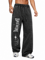 Lifestyle view of Timeline Jumper black heavyweight sweatpants with right-leg celestial print