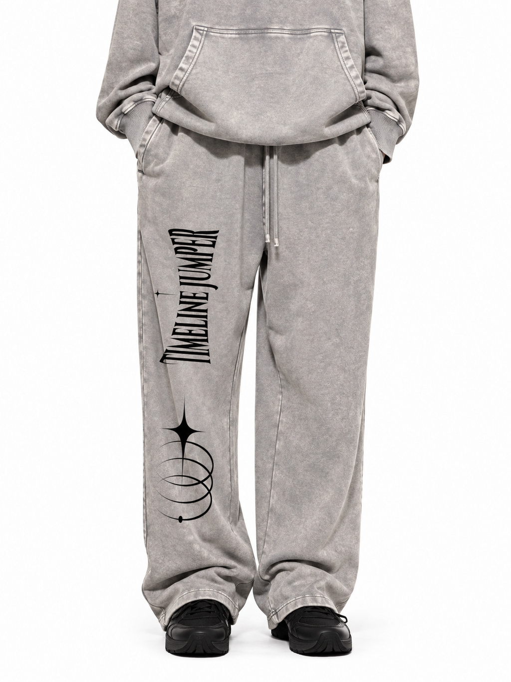 Model wearing Timeline Jumper light gray snow wash sweatpants with black artwork on the right leg