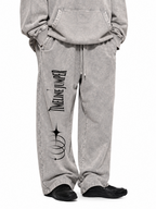 Lifestyle view of Timeline Jumper light gray heavyweight sweatpants with right-leg celestial print