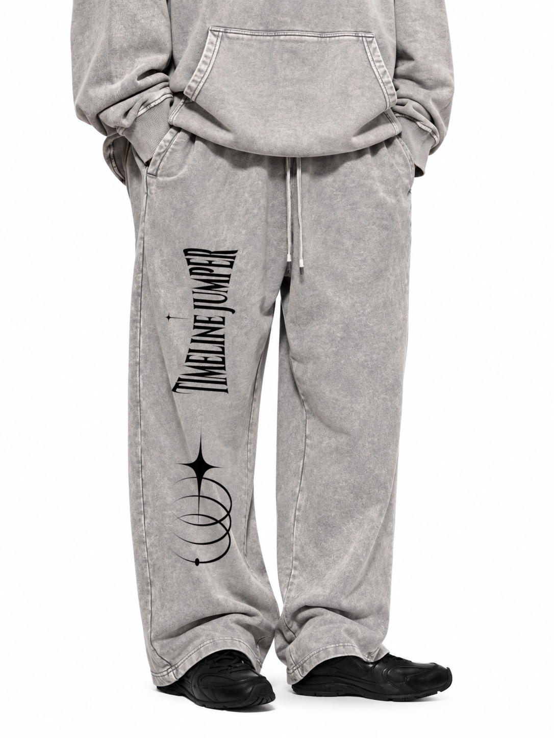 Lifestyle view of Timeline Jumper light gray heavyweight sweatpants with right-leg celestial print